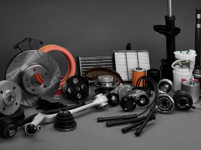 New car wheels and filters on a gray background. Parts closeup on a gray background